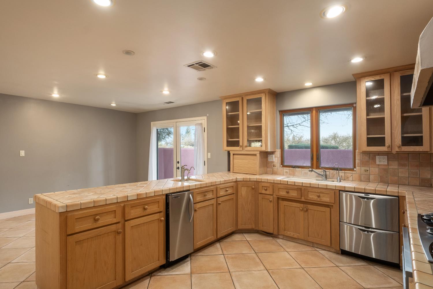 19282 East South Avenue Reedley, CA 93654 - Photo 16 of 33 a kitchen with a sink window and cabinets