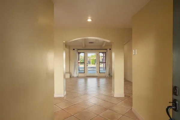 a view of a hallway with an empty room