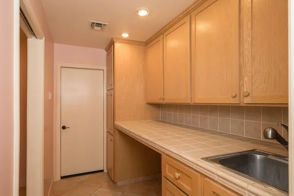 a kitchen with a sink and cabinets