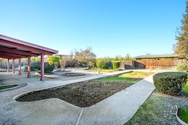 a view of a backyard with garden