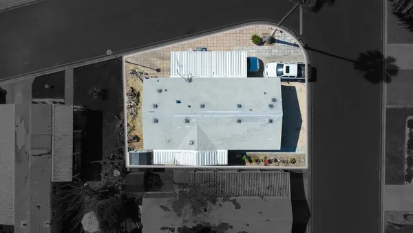 an aerial view of residential house with wooden stairs
