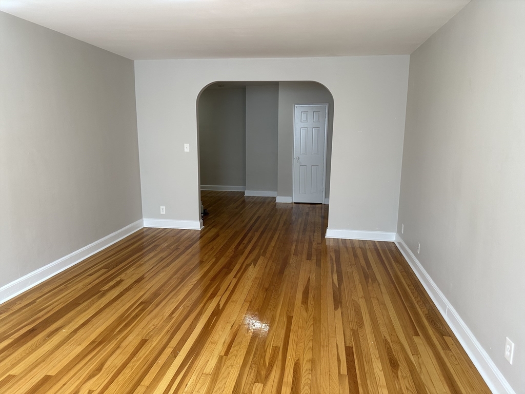 24 Concord Avenue, Unit 111 Cambridge, MA 02138 - Photo 2 of 17 a view of wooden floor in a room