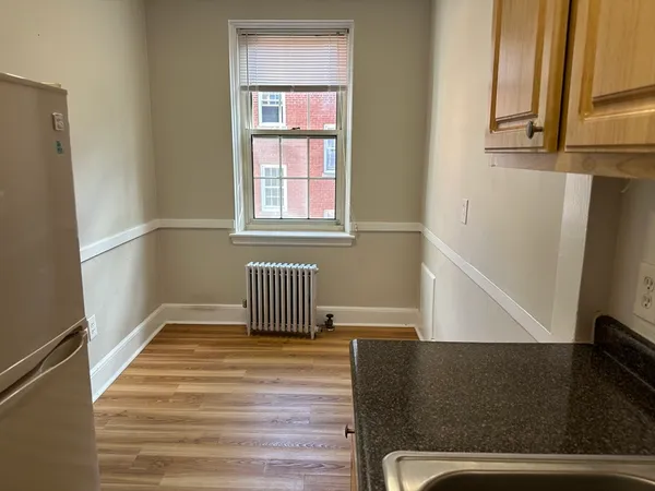 a view of wooden floor and windows in a room