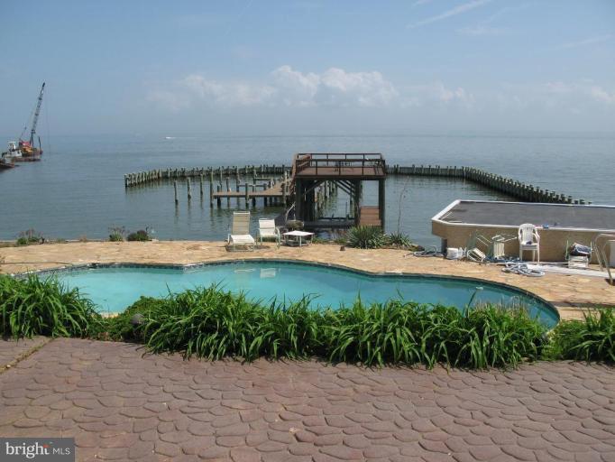 1303 Rogers Road, Unit 8 Annapolis, MD 21409 - Photo 1 of 19 POOL WITH DIVING BOARD; BOAT SLIPS AND PIER