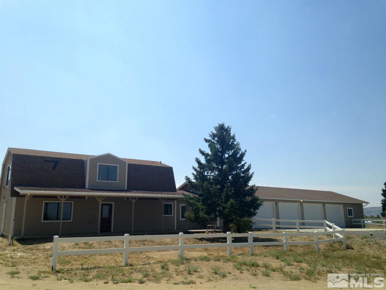 1240 Mineral Flat Road Reno, NV 89506 - Photo 1 of 1 a front view of a house with a yard