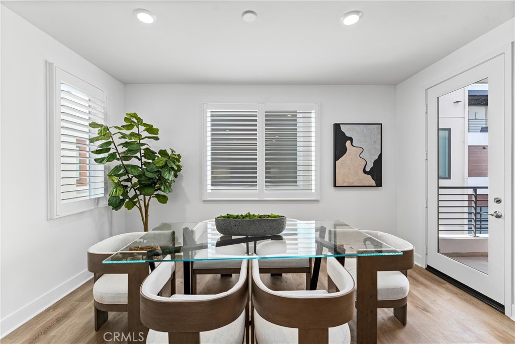 22 Transport Tustin, CA 92782 - Photo 11 of 44 a table with a potted plant and a window