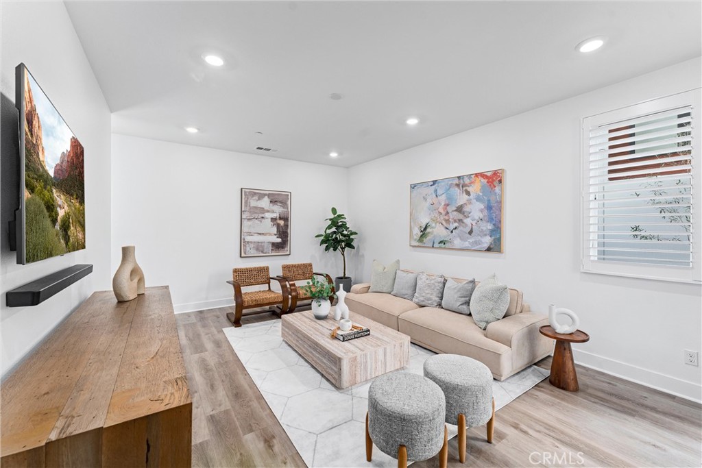 22 Transport Tustin, CA 92782 - Photo 15 of 44 a living room with furniture and a flat screen tv