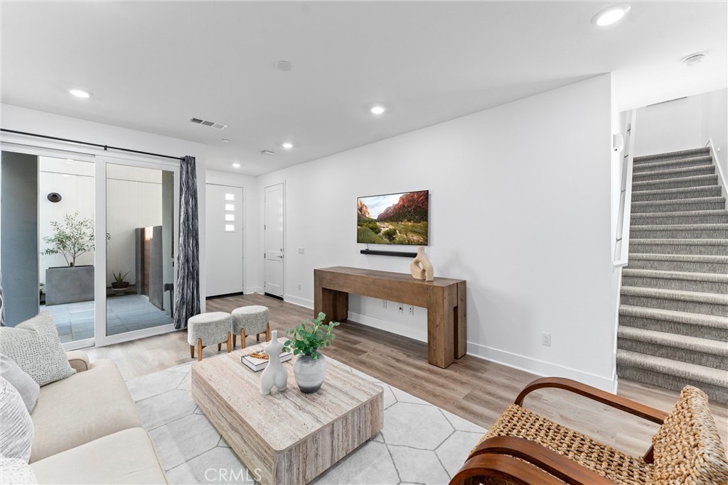 22 Transport Tustin, CA 92782 - Photo 17 of 44 a living room with furniture and a fireplace