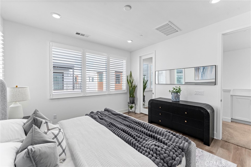 22 Transport Tustin, CA 92782 - Photo 19 of 44 a bedroom with a bed and a couch