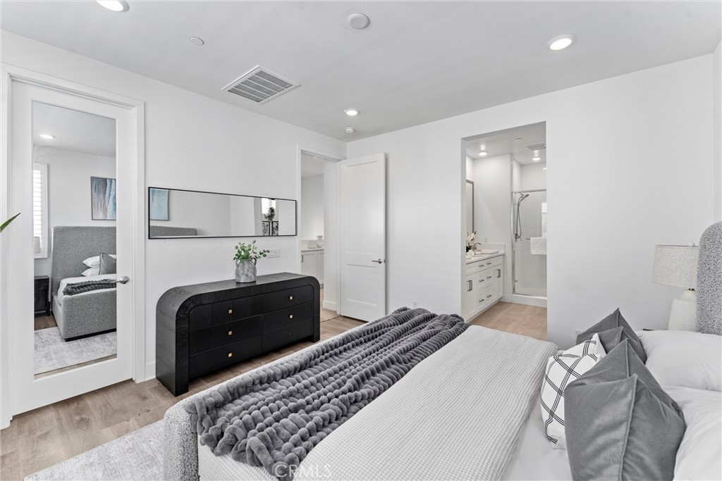 22 Transport Tustin, CA 92782 - Photo 20 of 44 a bedroom with a bed and a couch