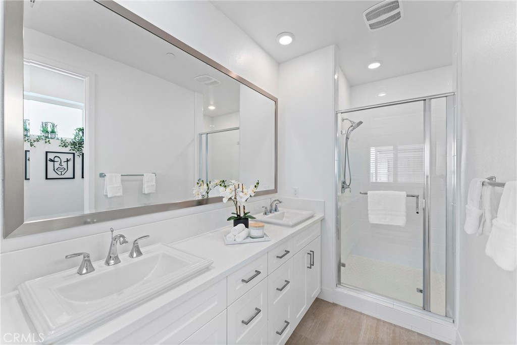 22 Transport Tustin, CA 92782 - Photo 21 of 44 a bathroom with a double vanity sink mirror double and shower
