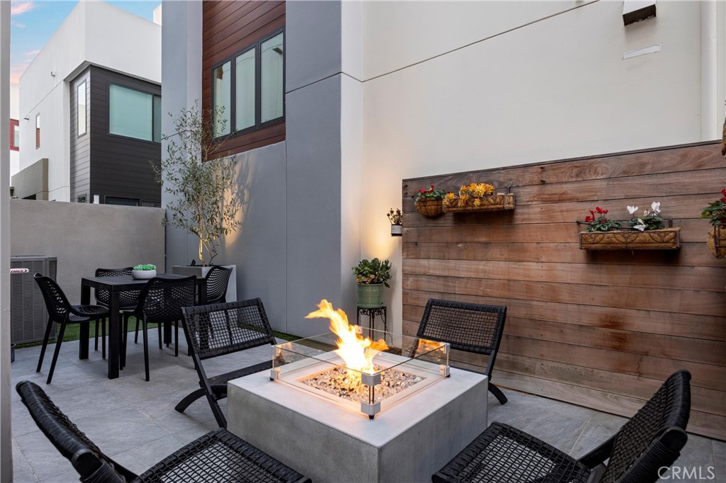 22 Transport Tustin, CA 92782 - Photo 27 of 44 a living room with furniture and a fireplace