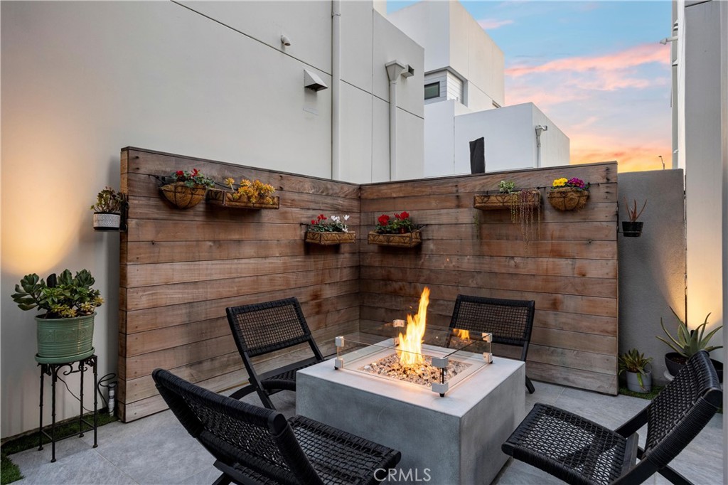 22 Transport Tustin, CA 92782 - Photo 29 of 44 a balcony with table and chairs