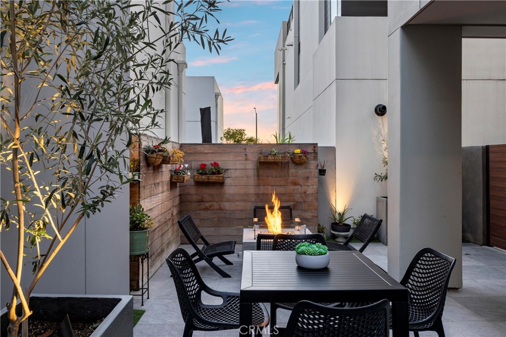 22 Transport Tustin, CA 92782 - Photo 30 of 44 a view of a dining room with furniture and wooden floor