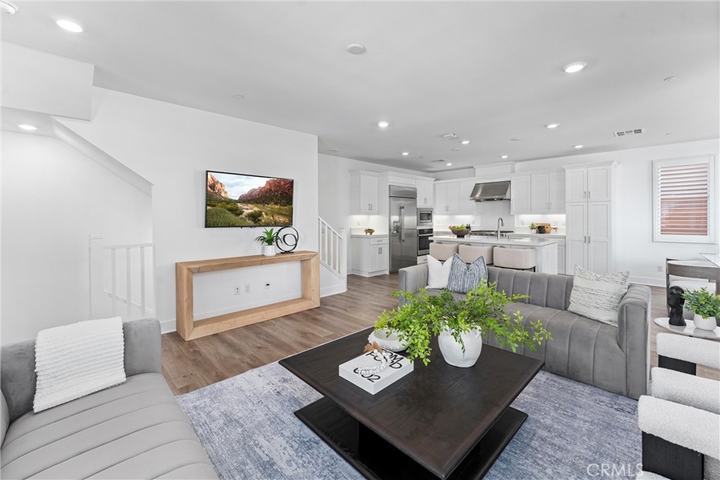 22 Transport Tustin, CA 92782 - Photo 9 of 44 a living room with furniture and a table