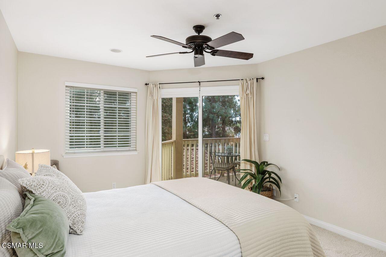 697 Sutton Crest Trail, Unit 302 Oak Park, CA 91377 - Photo 19 of 47 a bedroom with a bed and a window