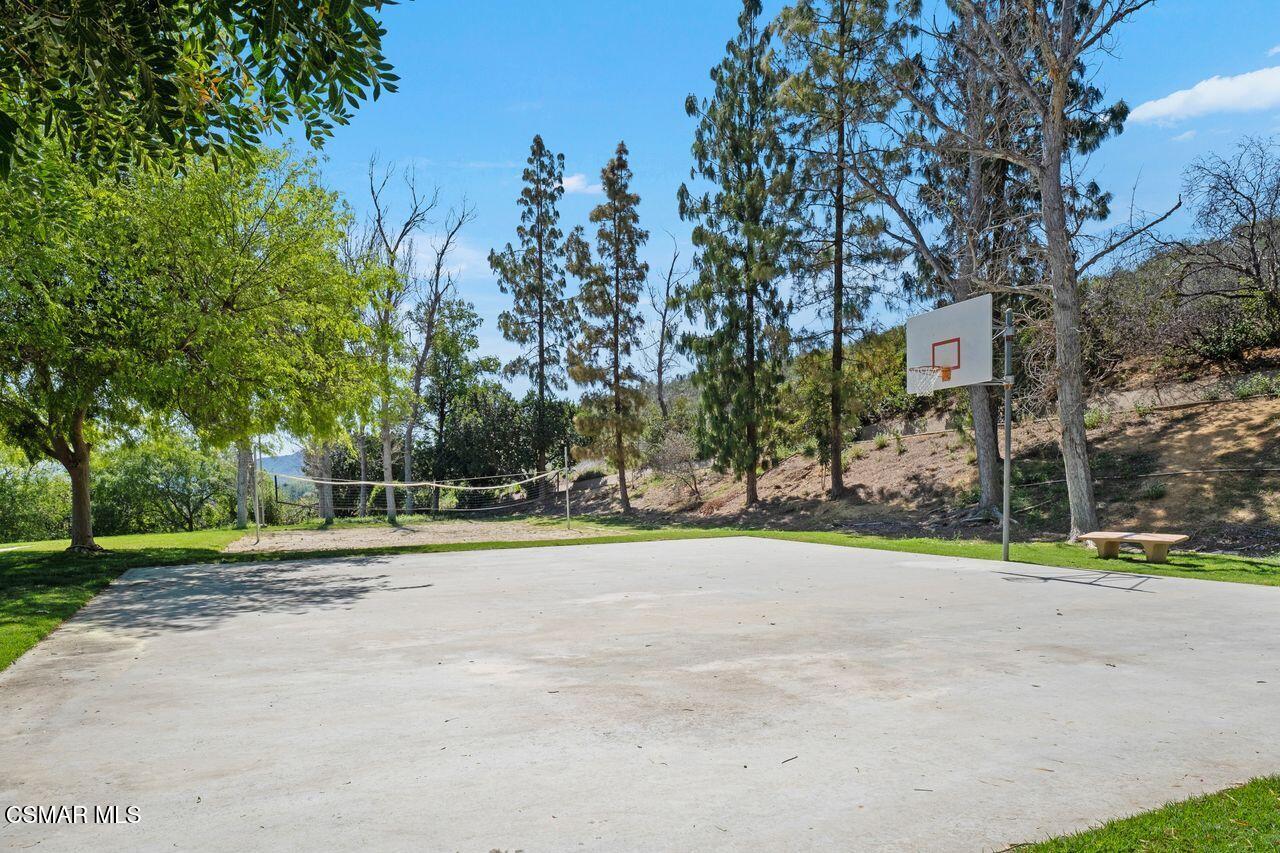 697 Sutton Crest Trail, Unit 302 Oak Park, CA 91377 - Photo 32 of 47 a view of road and trees