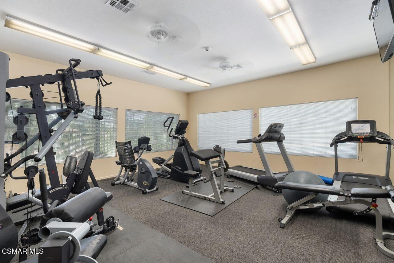 697 Sutton Crest Trail, Unit 302 Oak Park, CA 91377 - Photo 33 of 47 a view of a room with gym equipment
