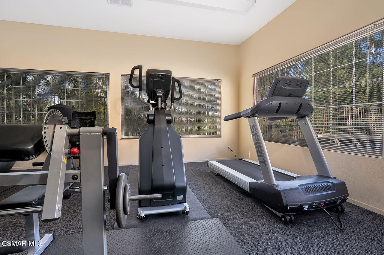 697 Sutton Crest Trail, Unit 302 Oak Park, CA 91377 - Photo 34 of 47 a view of a room with gym equipment