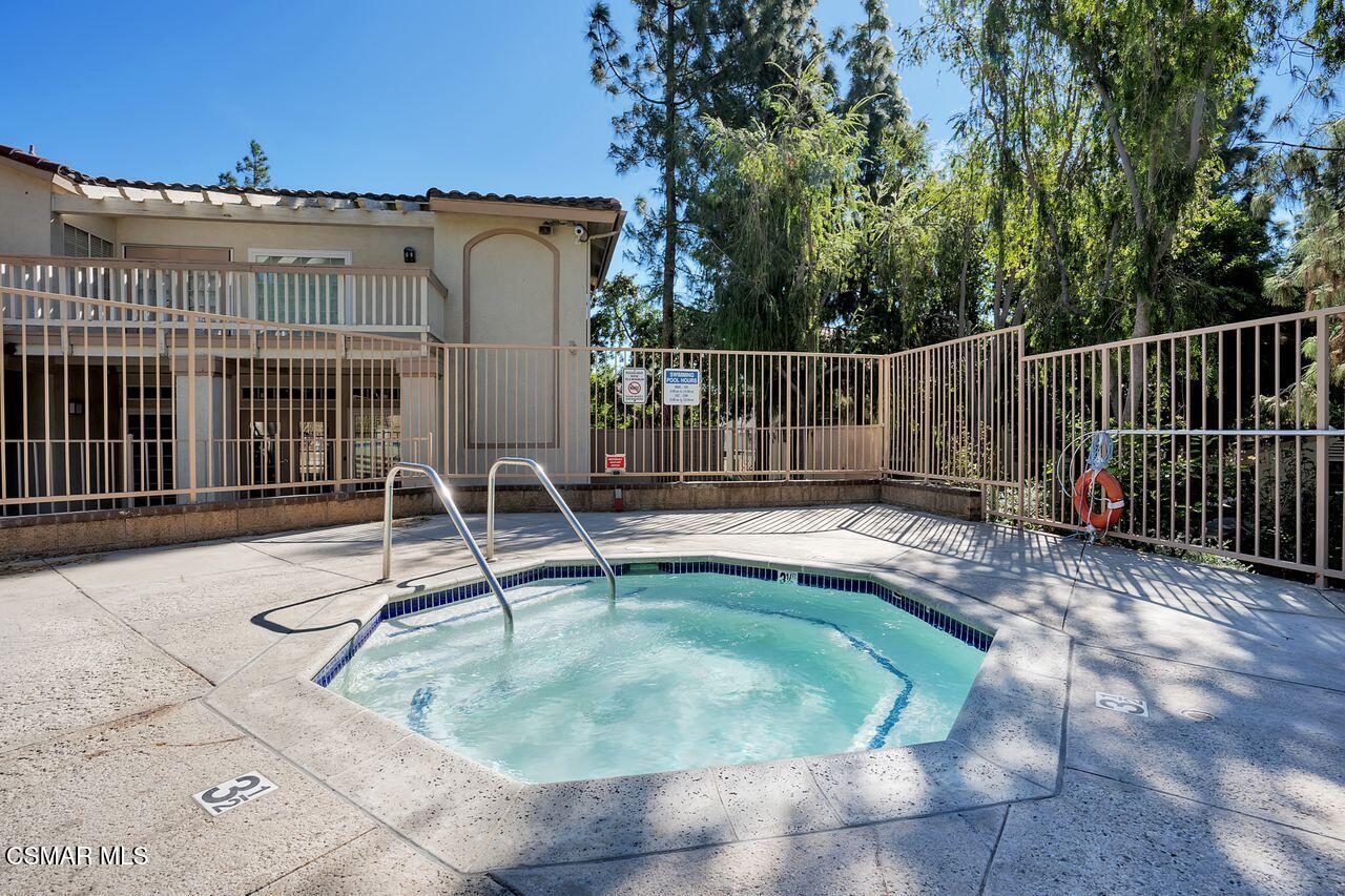 697 Sutton Crest Trail, Unit 302 Oak Park, CA 91377 - Photo 43 of 47 a house view with a outdoor space