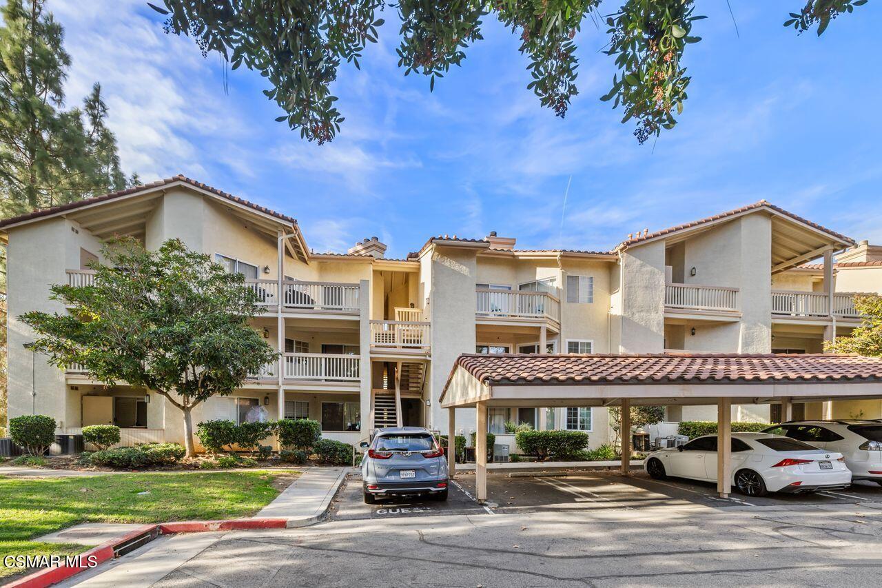 697 Sutton Crest Trail, Unit 302 Oak Park, CA 91377 - Photo 47 of 47 a front view of a building with street view
