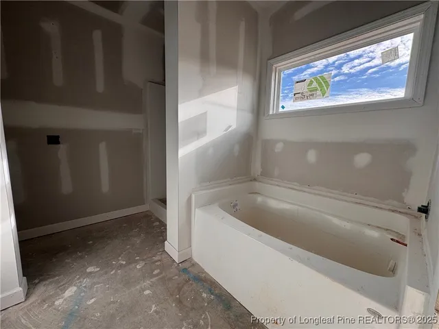 a kitchen with a sink and wooden cabinets