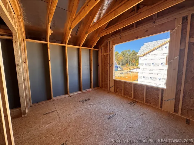 a view of a room with wooden walls