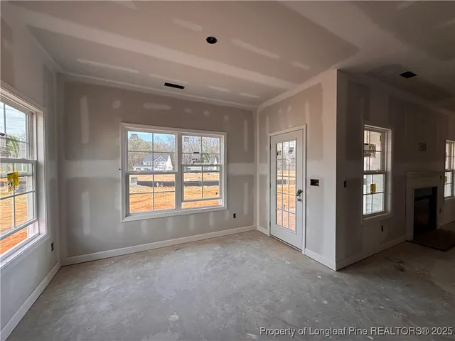 a view of an entryway with an empty room