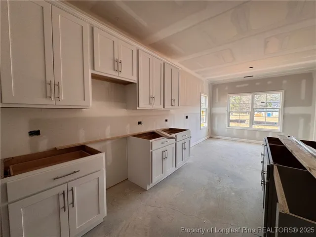 a view of a house with snow in the yard
