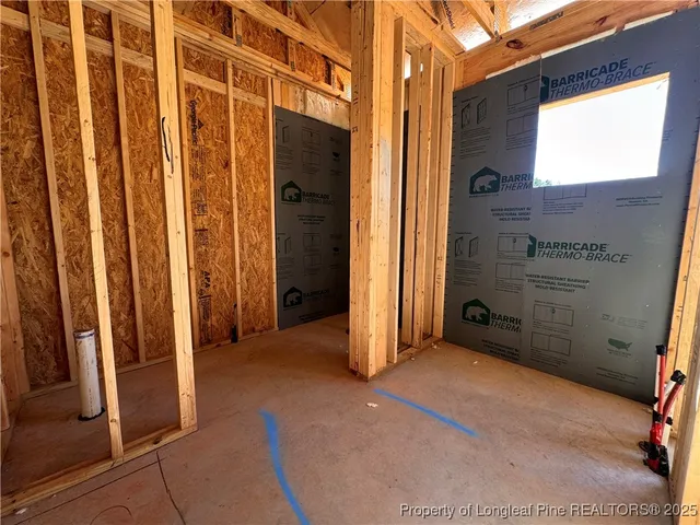 a view of a door with wooden floor and a curtain