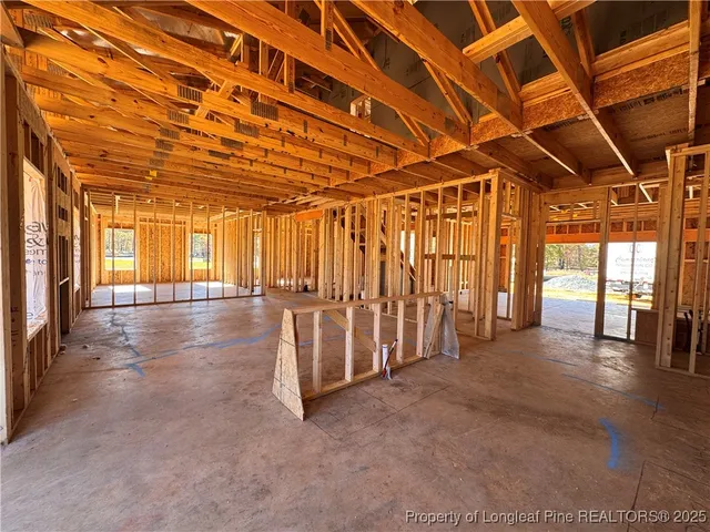 a view of an empty room with a fireplace