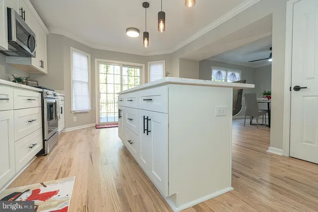 a view of hallway with wooden floor