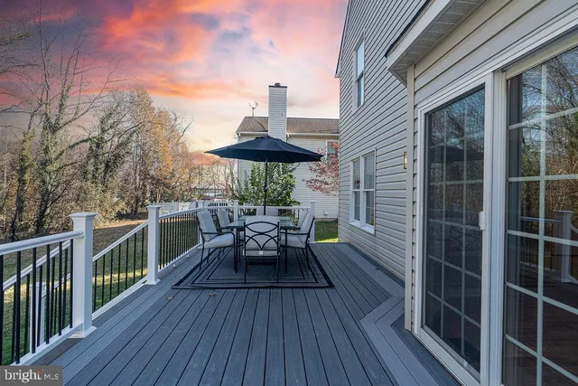 a view of balcony with furniture and wooden floor