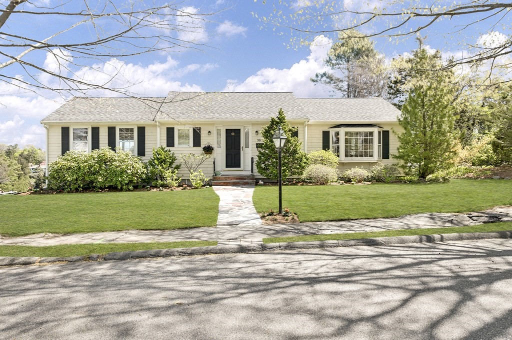 38 Crestwood Road Marblehead, MA 01945 - Photo 1 of 28 a front view of a house with a yard and potted plants