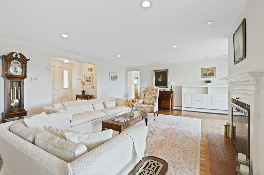 38 Crestwood Road Marblehead, MA 01945 - Photo 6 of 28 a living room with furniture a fireplace and a flat screen tv