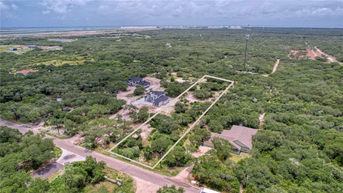 1493 4th Street Ingleside, TX 78362 - Photo 2 of 9 an aerial view of residential house with outdoor space and trees