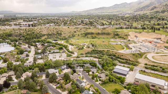 1552 Sumac Drive Logan, UT 84321 - Photo 62 of 72 Aerial perspective showcasing a residential neighborhood with surrounding natural landscapes