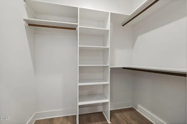 a bathroom with a granite countertop sink mirror and shower