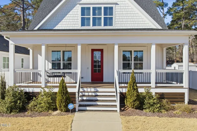 a front view of a house with a porch