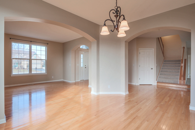 805 Myers Road Sugar Grove, IL 60554 - Photo 6 of 27 a view of an empty room with wooden floor and a window