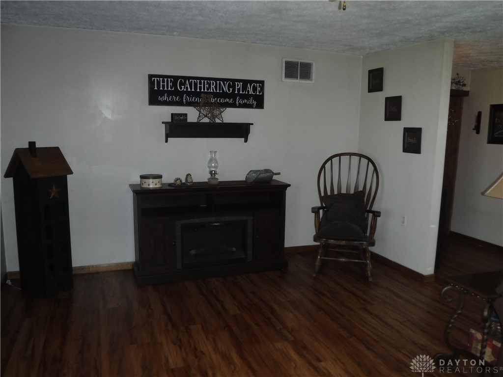 1912 Scheyhing Road Lewisburg, OH 45338 - Photo 8 of 25 More living room front door left to right leads to kitchen