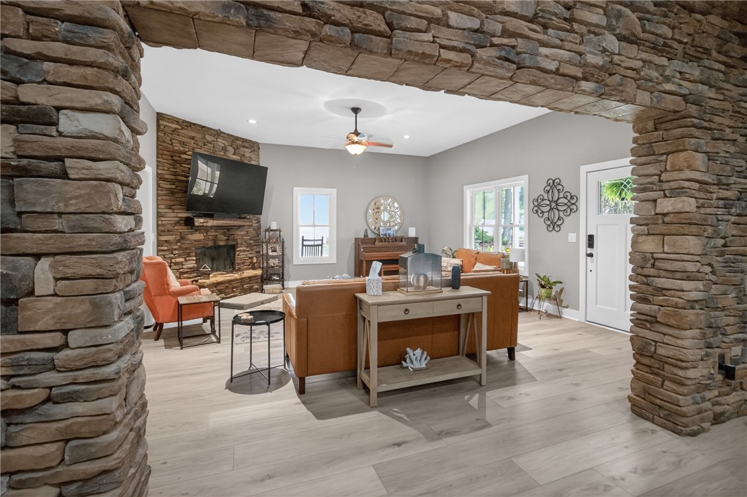 1504 Double Springs Road Townville, SC 29689 - Photo 4 of 41 This inviting living room showcases a beautiful stone fireplace and elegant flooring.