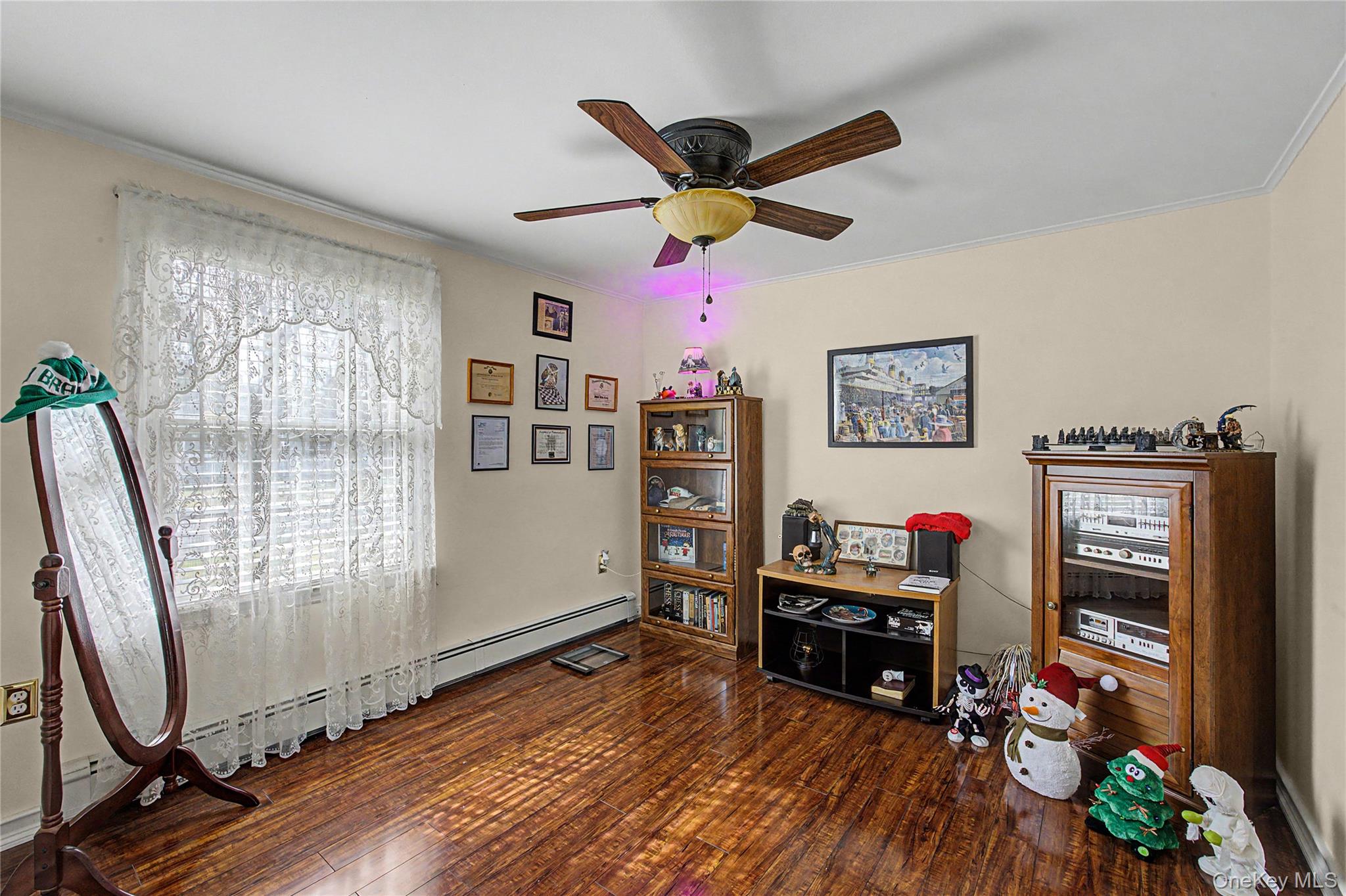 9 South Pond Trail Ridge, NY 11961 - Photo 12 of 40 a living room with furniture and a flat screen tv