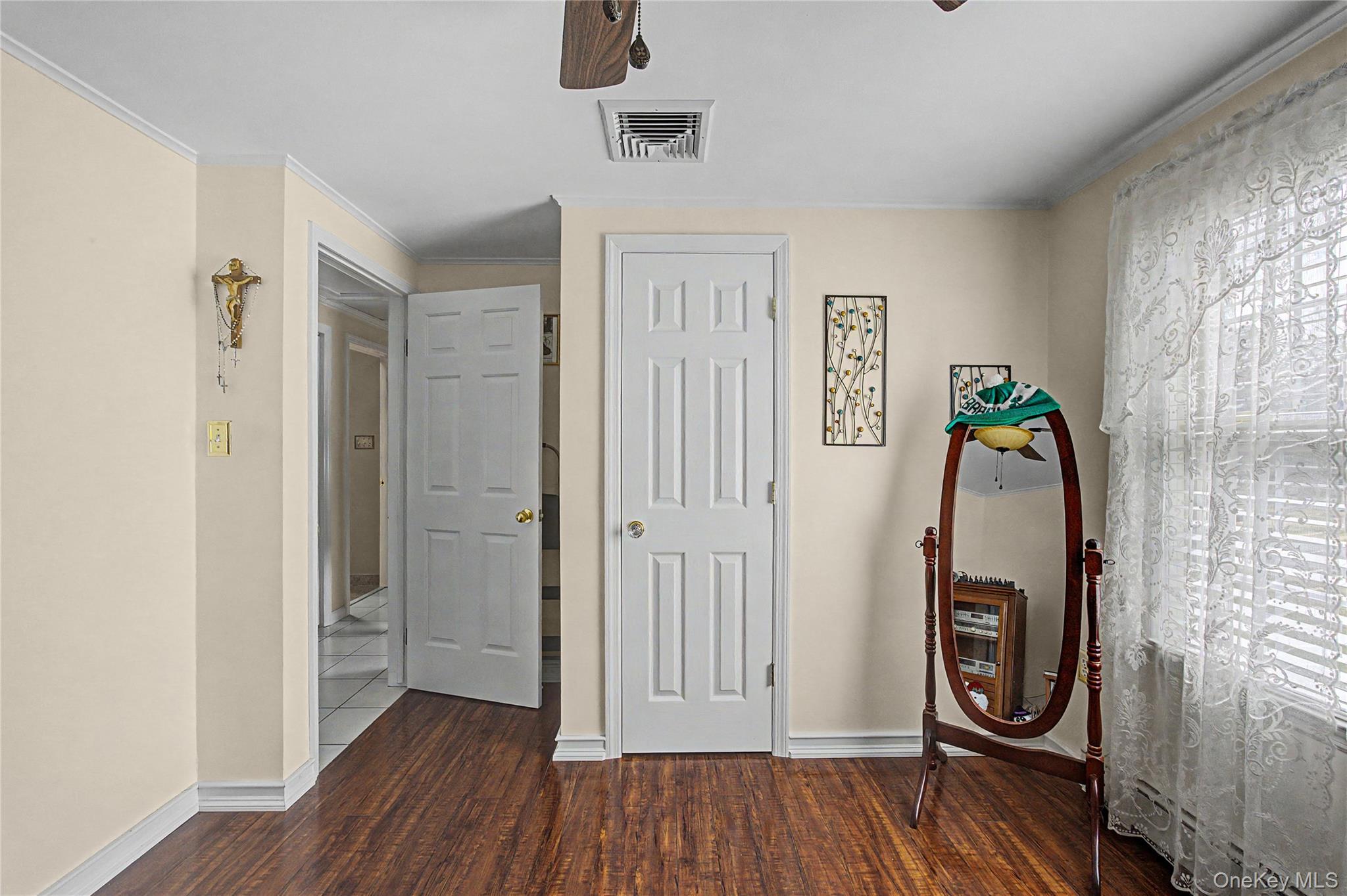 9 South Pond Trail Ridge, NY 11961 - Photo 13 of 40 a view of a hallway with wooden floor and stairs
