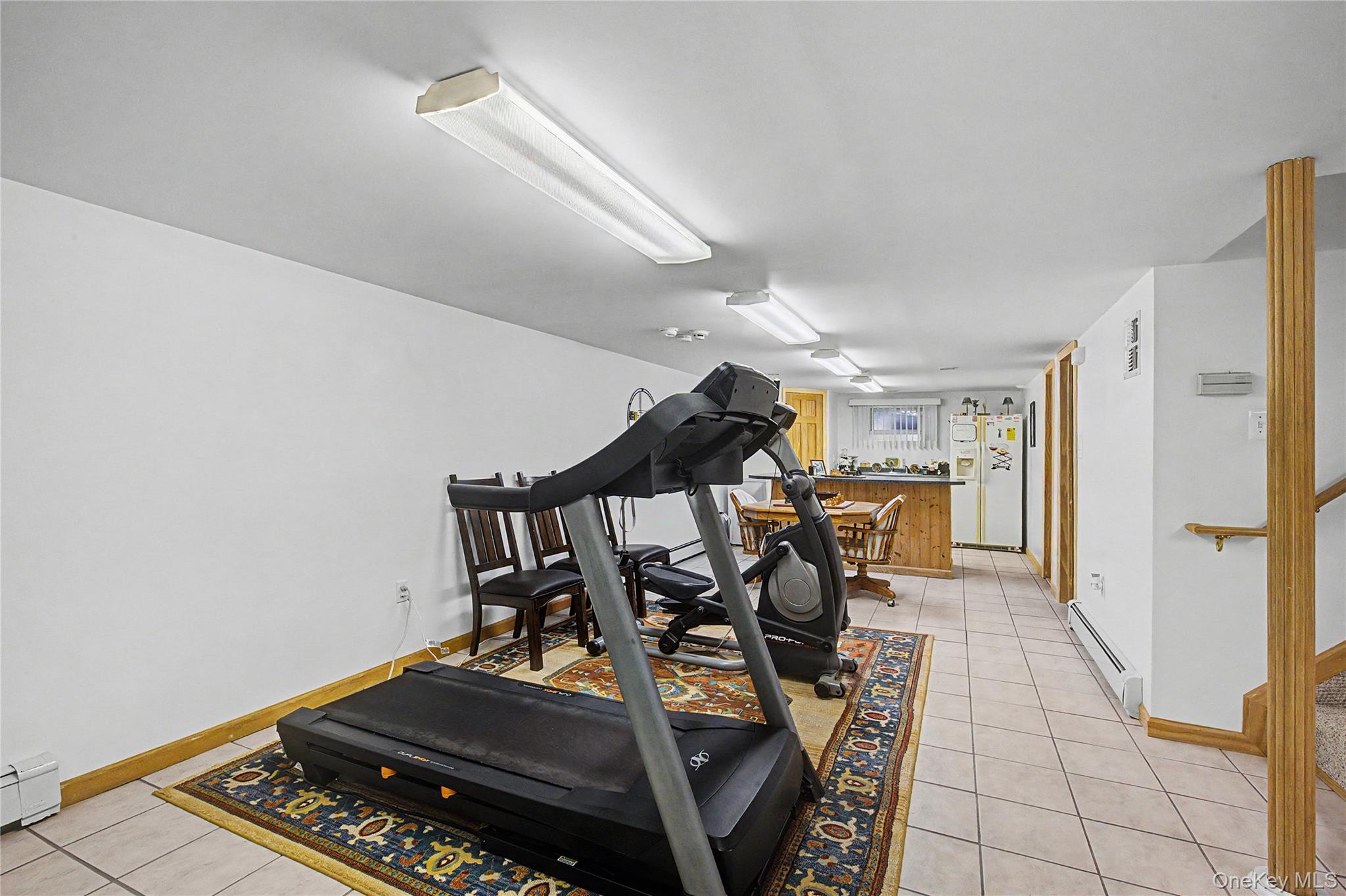 9 South Pond Trail Ridge, NY 11961 - Photo 19 of 40 a view of a room with gym equipment