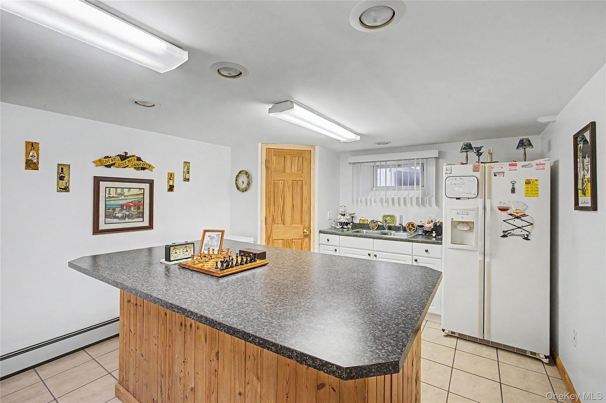9 South Pond Trail Ridge, NY 11961 - Photo 21 of 40 a kitchen with stainless steel appliances granite countertop a refrigerator and a stove