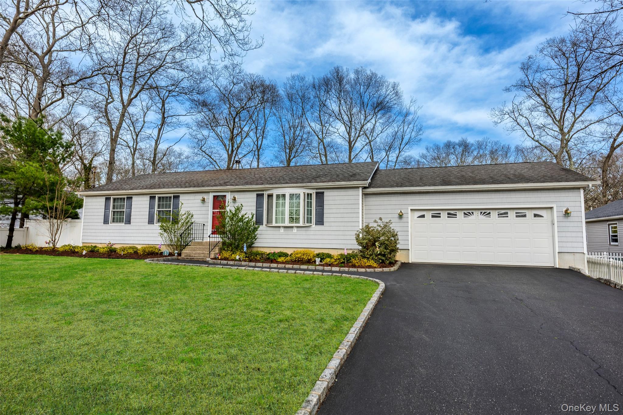 9 South Pond Trail Ridge, NY 11961 - Photo 4 of 40 front view of a house with a yard