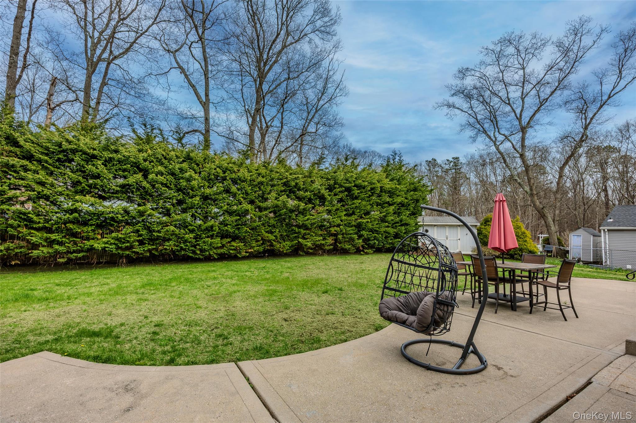 9 South Pond Trail Ridge, NY 11961 - Photo 8 of 40 a view of outdoor space yard deck and patio