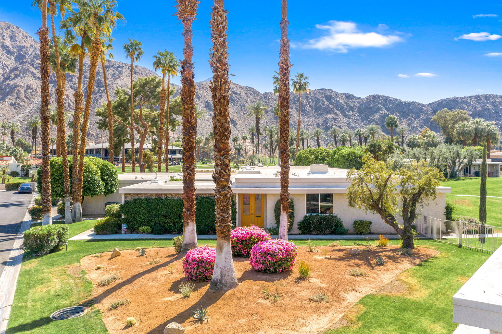 45835 Pawnee Road Indian Wells, CA 92210 - Photo 1 of 46 a view of swimming pool with a patio and a garden