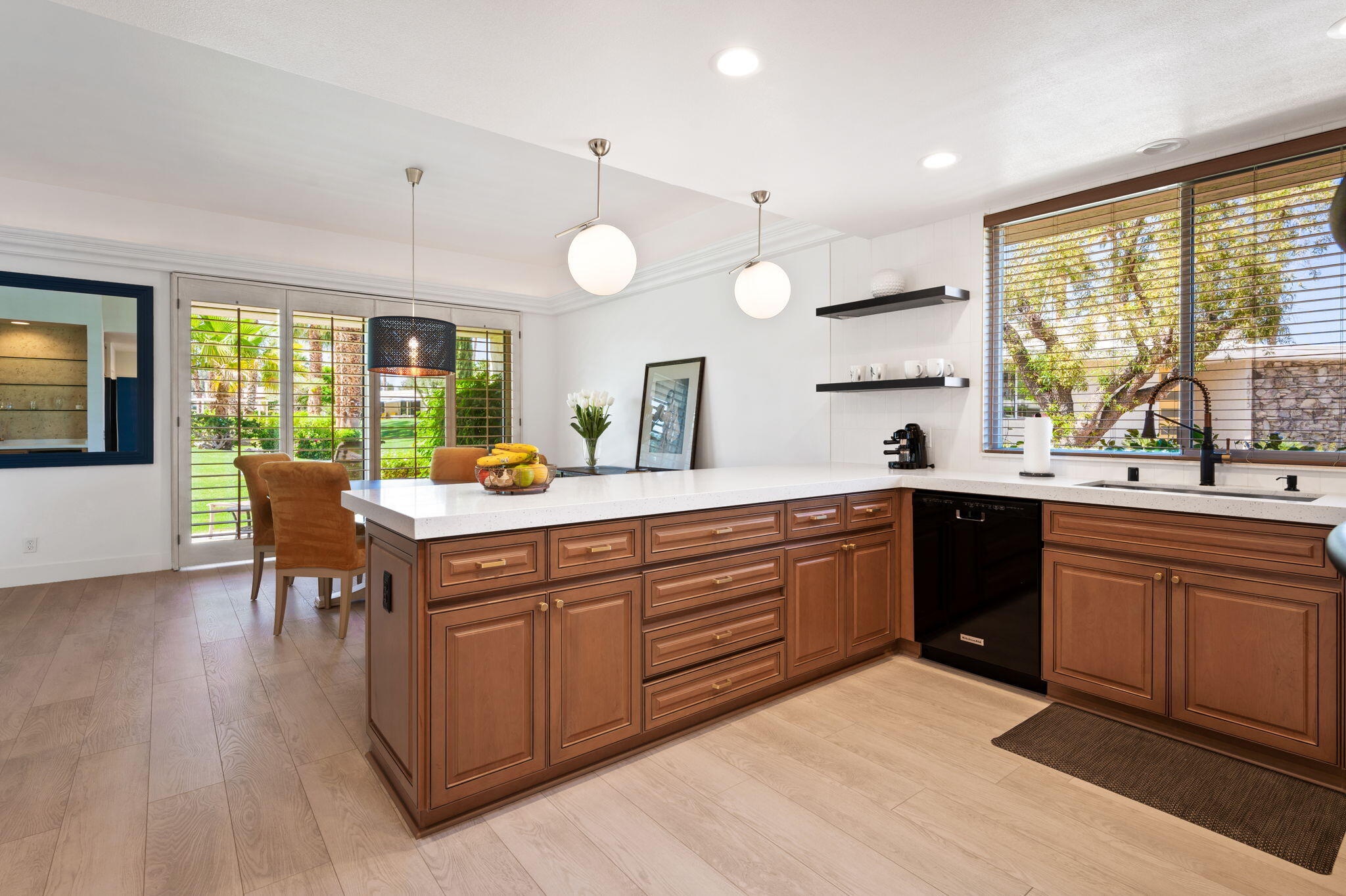 45835 Pawnee Road Indian Wells, CA 92210 - Photo 16 of 46 a kitchen with a sink dining table and chairs